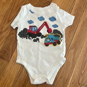 BOGO onesie with red and blue trucks on the front